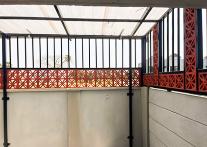 Covered Balcony with Red Screen Panels