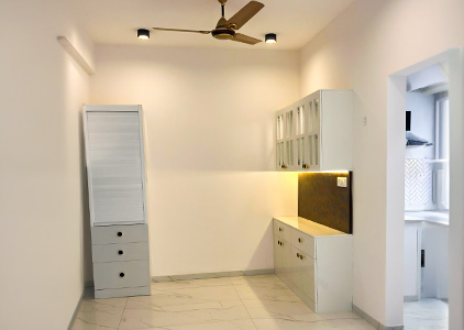Dining space with sleek storage and cabinets