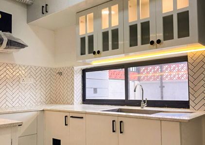 Modern white modular kitchen in interior Jumbo